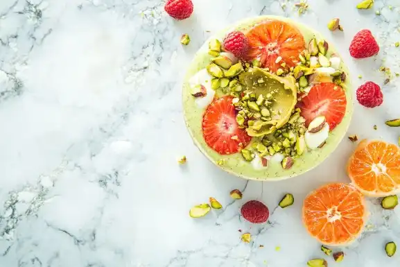 Smoothie bowl with pistachio butter and toppings.